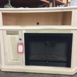Entertainment center featuring an electric fireplace